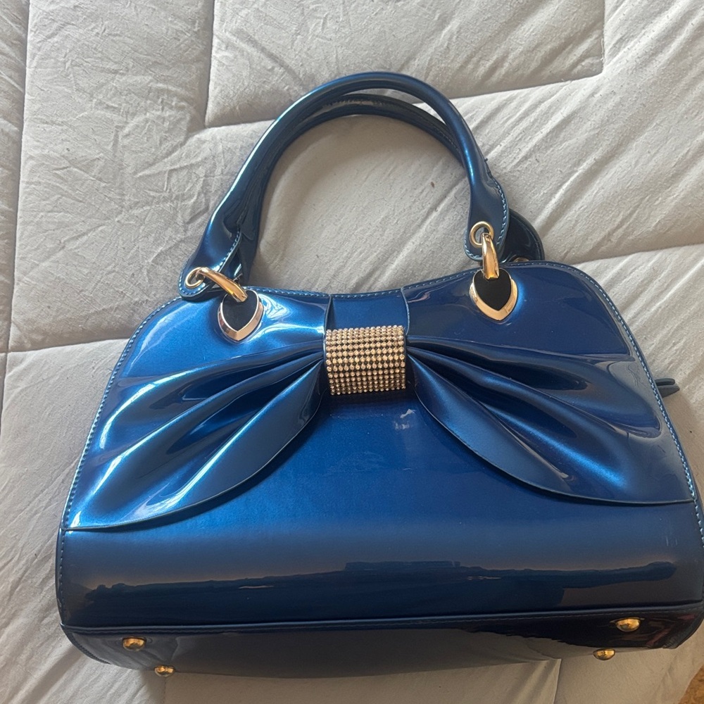 Elegant Blue Handbag with Bow Accent